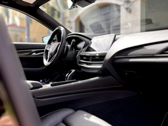 Sunlit view of a luxurious car dashboard