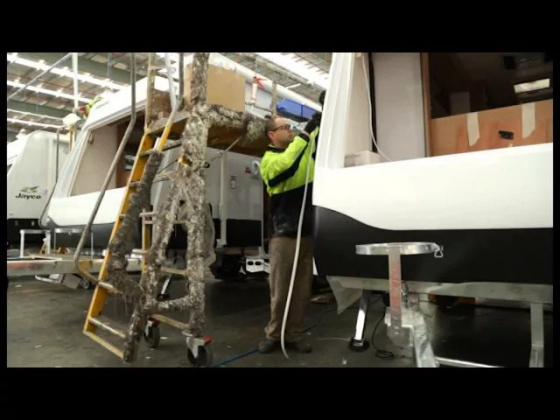 Man working on caravan assembly line