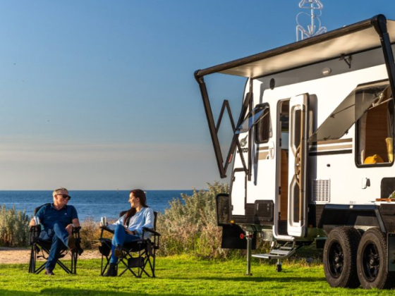 Relaxing by an RV with ocean view on a sunny day