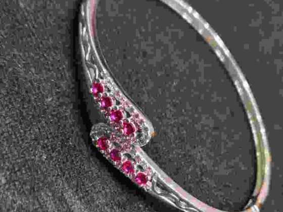 Elegant bracelet adorned with red stones