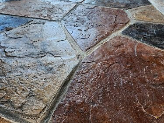 Decorative stone tile patio in warm earth tones