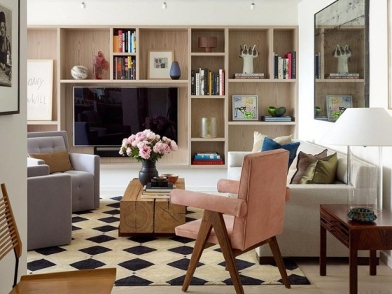 Cozy living room featuring a TV and book-filled shelves