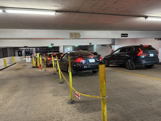 Vehicles lined up in parking garage area
