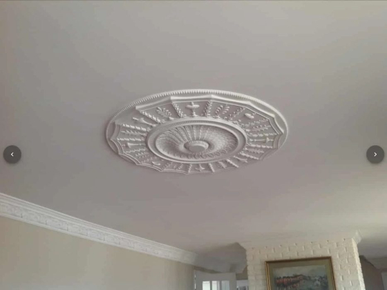 Decorative ceiling detail with intricate patterns and molding