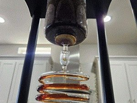 Coffee dripping through a spiral cooling tube