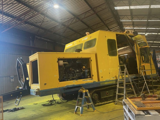 Industrial machine under maintenance in factory setting