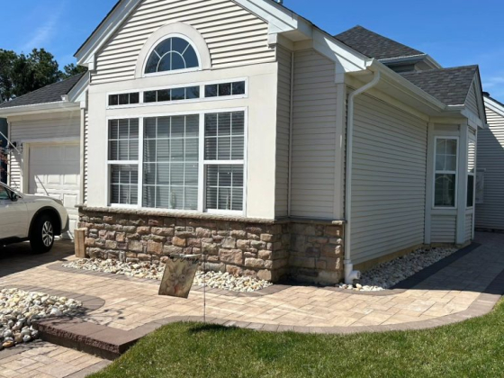 Charming home exterior with stone and siding design
