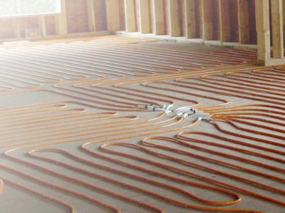 Underfloor heating coils laid out in a new building
