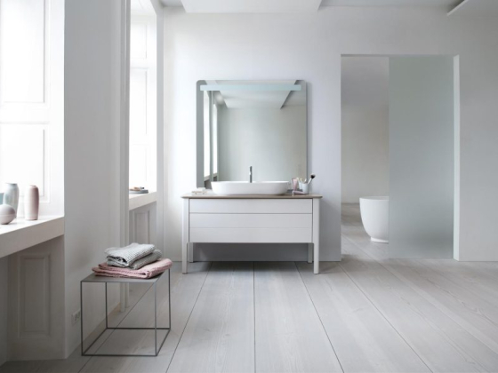 Spacious bathroom showcasing sleek design and neutral tones