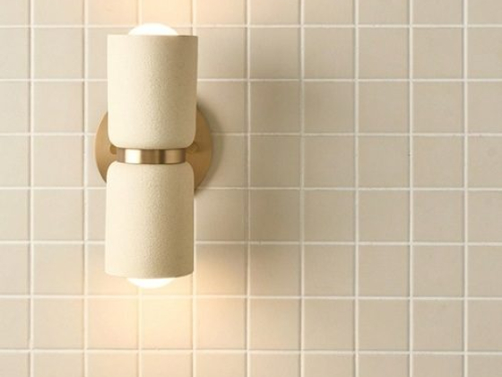 Modern sconce on a beige tiled wall