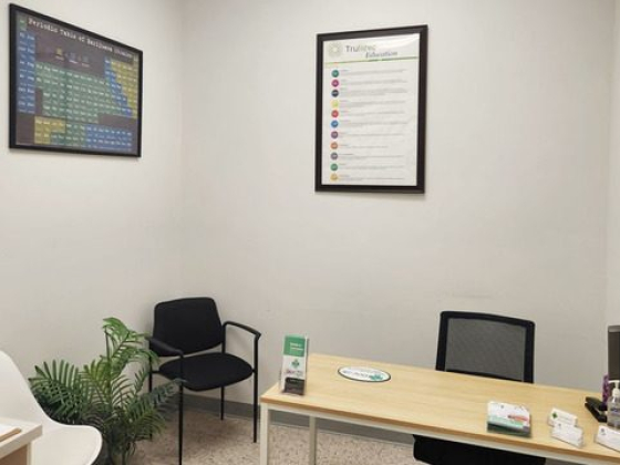 Tidy office space with a desk, chairs, and decor