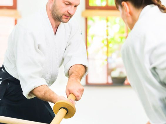Martial arts training session using wooden practice swords