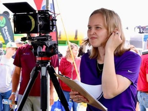Woman preparing to record at an outdoor event